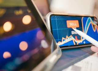 Trader reviewing Bitcoin Ethereum and forex options across multiple markets